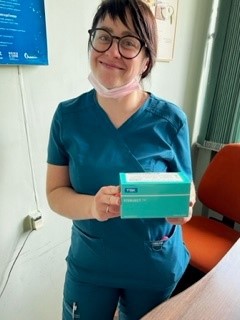 Pediatric Ophthalmologist Dr. Tetyana holding a box with TSK STERiJECT™ needles.