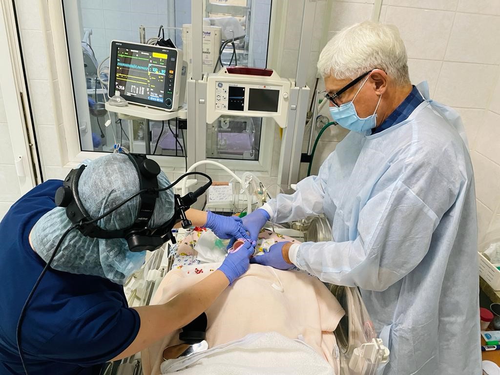 Dr. Runge with Dr. Tetyana examining the eyes of a premature infant in the neonatal intensive care unit (NICU) at the Ivano-Frankivsk children’s hospital.